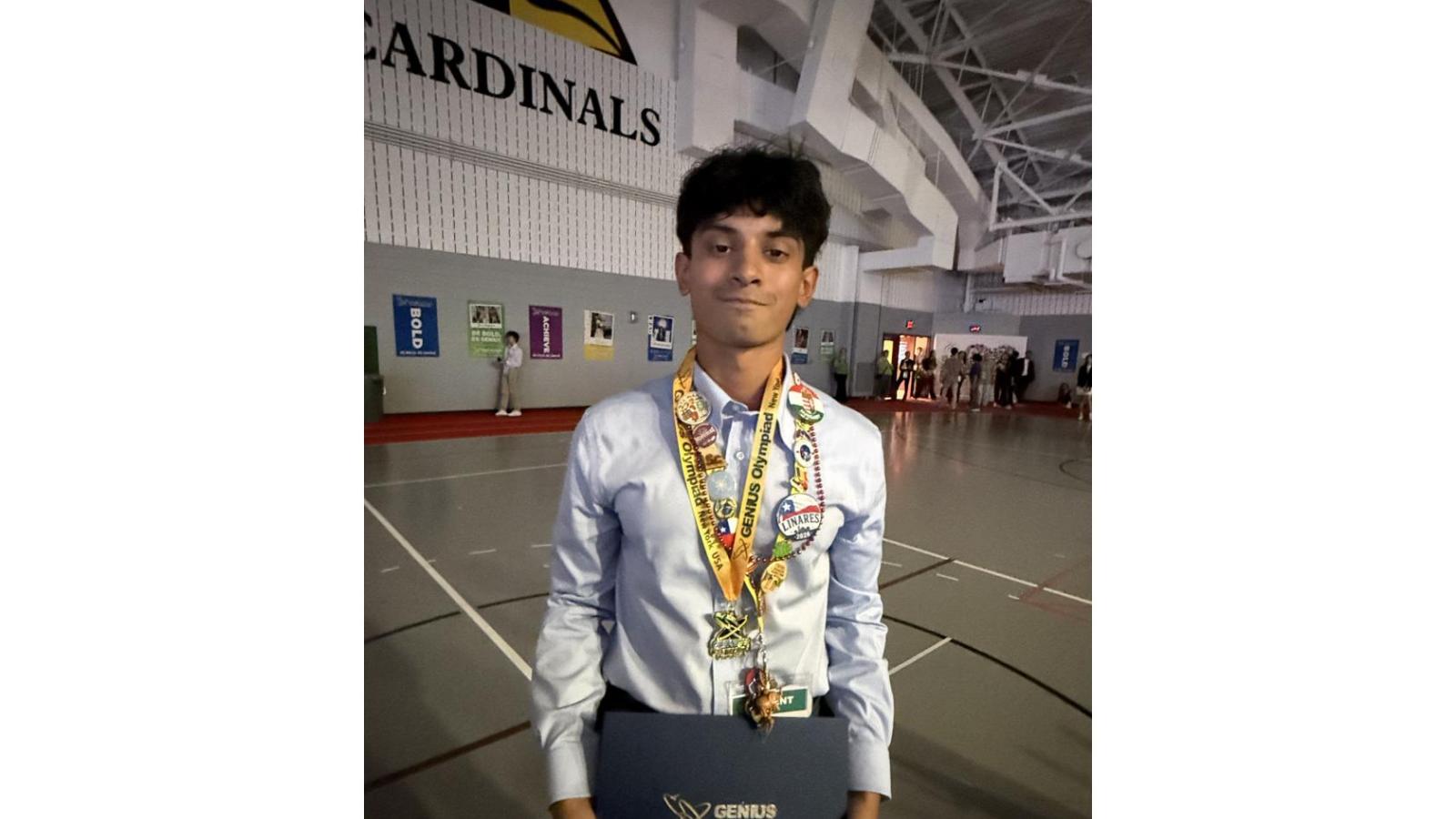 Matthew Ponnaiya with his Gold award at the International Genius Olympiad