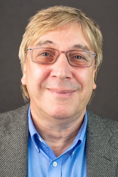 David J. Brenner, PhD Head shot of man wearing glasses and blue dress shirt